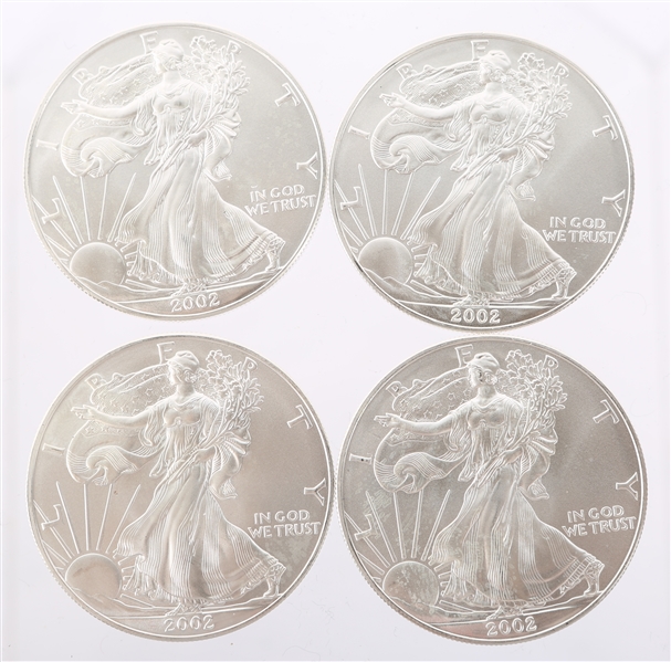 2002 UNITED STATES SILVER AMERICAN EAGLES - LOT OF 4