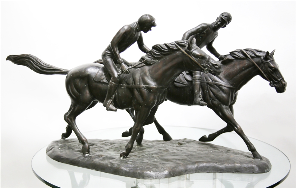 BRONZE STATUE OF TWO JOCKEYS VYING FOR THE WIN IN A HORSE RACE