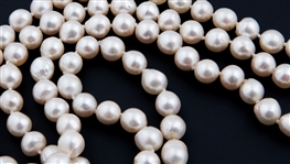 STRAND OF BAROQUE PEARLS WITH 14K YELLOW GOLD CLASP