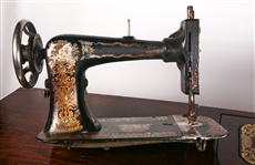 EARLY 20TH C. TREADLE SEWING MACHINES & WOOD CABINET