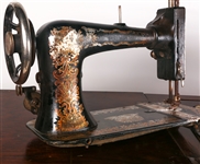 EARLY 20TH C. TREADLE SEWING MACHINES & WOOD CABINET