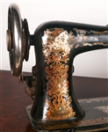EARLY 20TH C. TREADLE SEWING MACHINES & WOOD CABINET