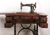 EARLY 20TH C. TREADLE SEWING MACHINES & WOOD CABINET