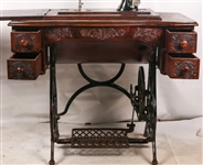 EARLY 20TH C. TREADLE SEWING MACHINES & WOOD CABINET