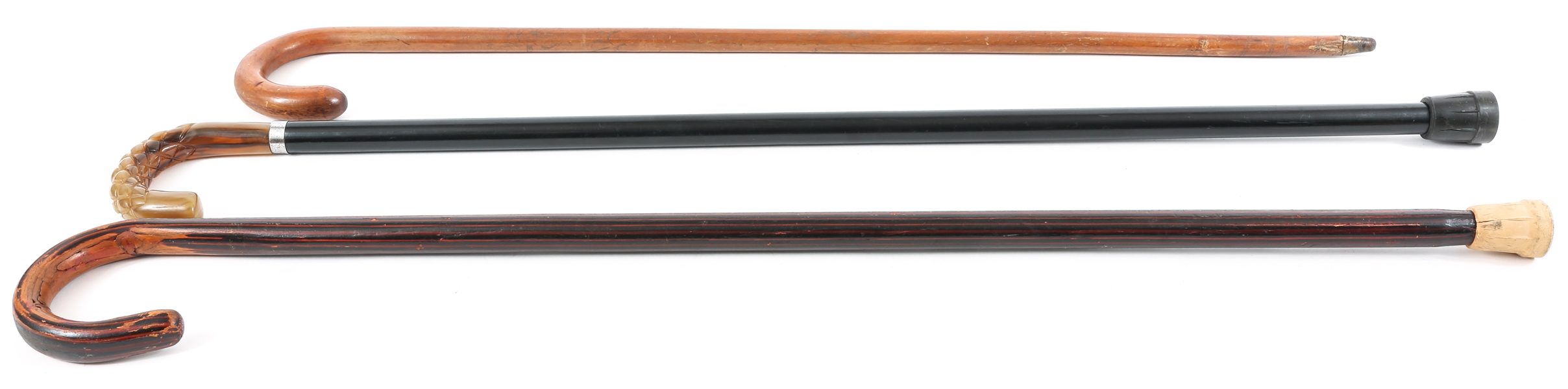 THREE WOODEN CROOK HANDLED CANES 