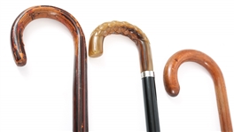 THREE WOODEN CROOK HANDLED CANES 