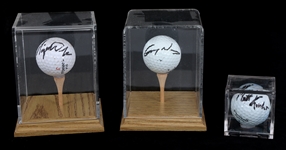 AUTOGRAPHED GOLF BALLS - WOODS, NORMAN, & KUCHAR 