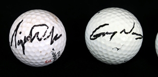 AUTOGRAPHED GOLF BALLS - WOODS, NORMAN, & KUCHAR 